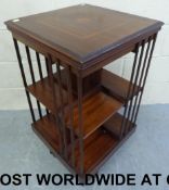 An Edwardian inlaid revolving bookcase (