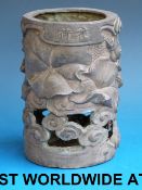 A Chinese bronze brush pot decorated wit