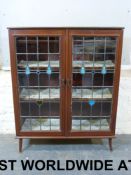 An Art Nouveau glazed display cabinet (w