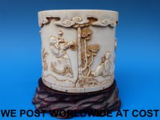 A 19thC Chinese ivory brush pot finely d
