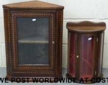 A mahogany inlaid corner display cabinet