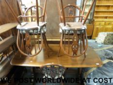 An Ercol dining table (length 152cm dept