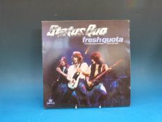 Thirteen STATUS QUO LPs, one 12in Single