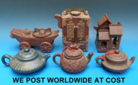 A collection of 20thC Yixing teapots wit