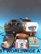 A collection of cameras and binoculars t
