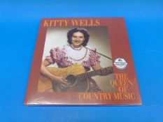 Nineteen Country & Western LPs.  Kitty W