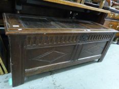 An 18thC oak coffer having three panel t