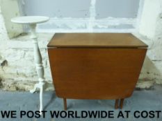 A retro drop leaf table together with a