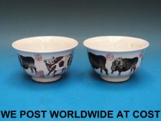 A pair of Chinese bowls with buffalo dec