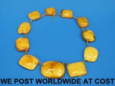 An amber necklace consisting of 11 beads