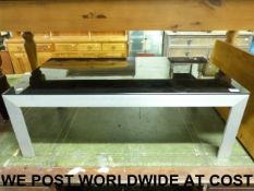 A modern coffee table with smoked glass