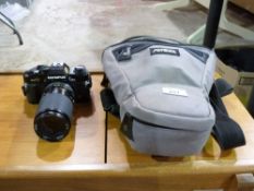 An Olympus OM40 SLR camera with Tamron l