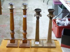 A pair of lamp bases and a pair of candl