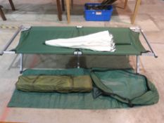Three various folding camp beds and a pa