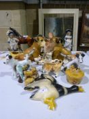 A collection of ceramic animals includin