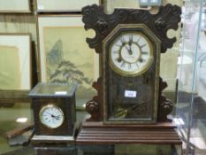 A glass fronted mantel clock striking on