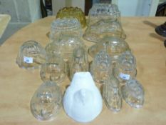 A collection of glass jelly moulds to in