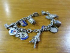 A white metal charm bracelet with around