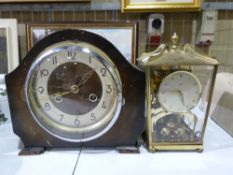 A brass cased anniversary clock together