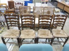 A set of four ladder back rush seated di