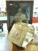 A brass coal scuttle and a fire screen