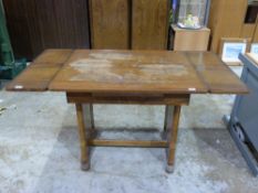 An Art Deco burr walnut extending dining