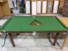 A 1/4 size snooker table with triangle