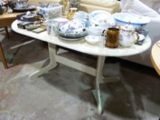 A modern white extending dining table