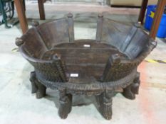 An Eastern carved dog basket or crib wit