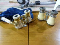 Two sets of opera glasses, one being mot