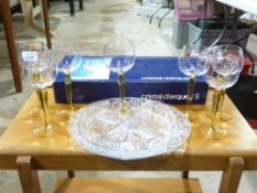 Two sets of glasses and an hors d'oeuvre