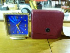 A cased Imhof travelling clock with blue