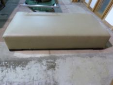 A large leather footstool