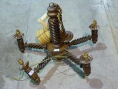 An oak wrythen ceiling mounted light fit