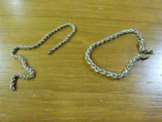 A yellow metal chain stamped 9kt togethe