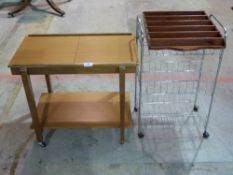 A set of chrome shelves on wheels, small