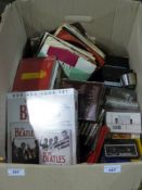 A box of music including CD's, singles,