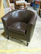 A brown leather tub chair