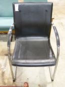 A chrome framed retro desk chair