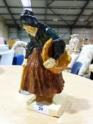 A Henriot Quimper figure of a lady with