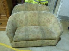 A pair of small two seat sofas