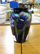 A Moorcroft vase on a blue ground decora