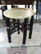 A small eastern brass topped folding tab