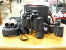 Three various pairs of binoculars