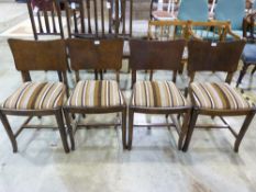 A set of four oak Art Deco dining chairs