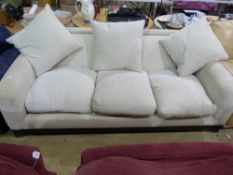 A white three seater sofa