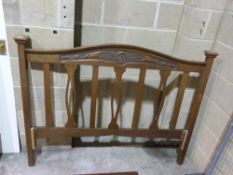A carved oak Art Nouveau bed head