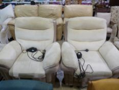 A pair of electric recliner armchairs