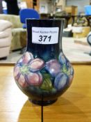 A Moorcroft vase with blue ground decora