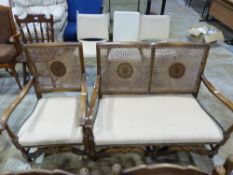 An oak bergere two seater sofa together